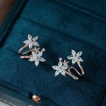 Arihant Rose Gold Plated American Diamond Studded Triple Star Shaped Earrings