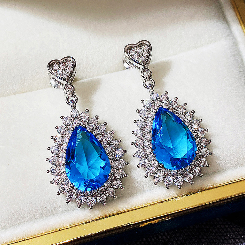 Arihant Silver Plated American Diamond Studded Blue Teardop Shape Ice Cut Drop Earrings