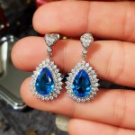 Arihant Silver Plated American Diamond Studded Blue Teardop Shape Ice Cut Drop Earrings