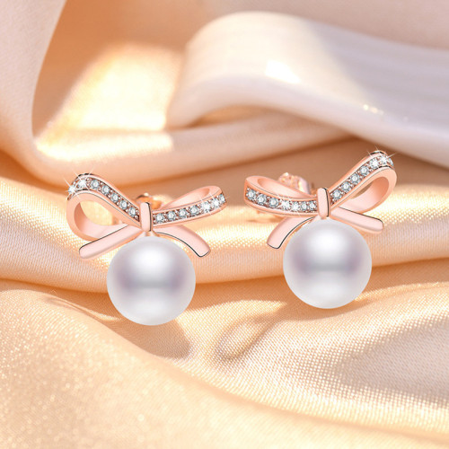 Arihant Rose Gold Plated American Diamond Studded Bow-Tie Shape Korean Stud Earrings