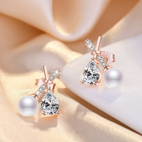 Arihant Rose Gold Plated American Diamond Studded Cross Shape Korean Stud Earrings