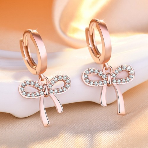 Arihant Rose Gold Plated American Diamond Studded Bow-Tie Shape Korean Stud Earrings